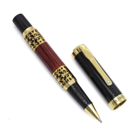 Luxury red and black fountain pen with engraved golden accents and polished cap.